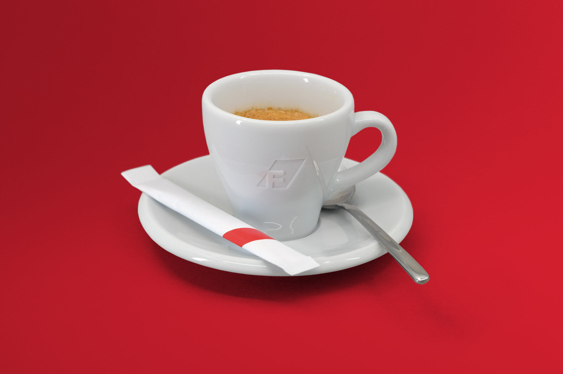 Espressotasse mit graviertem Logo und Zuckerstick